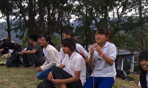 CHILDREN WATCHING THE FOOTBALL MATCH 